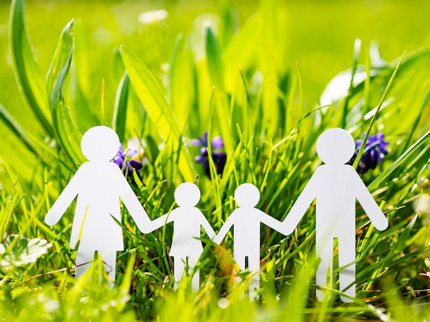 Photo paper family on green grass