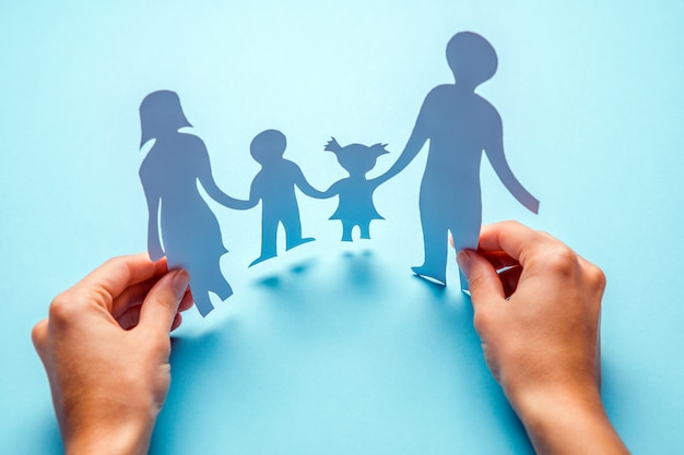 Paper family in hand isolated