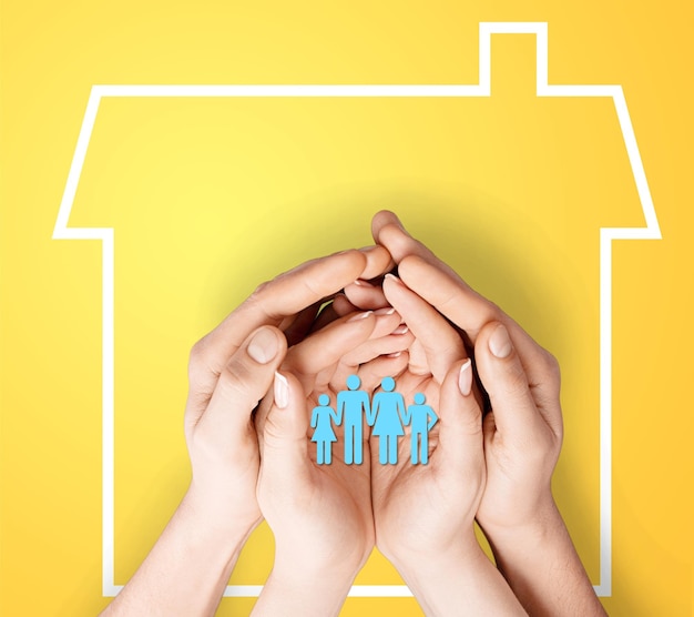 Paper family in hands with home on blue background welfare concept