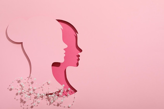 paper female head on a light background
