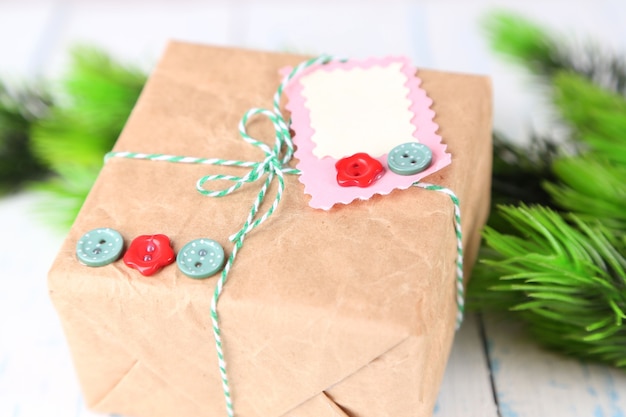 Paper gift box on wooden background