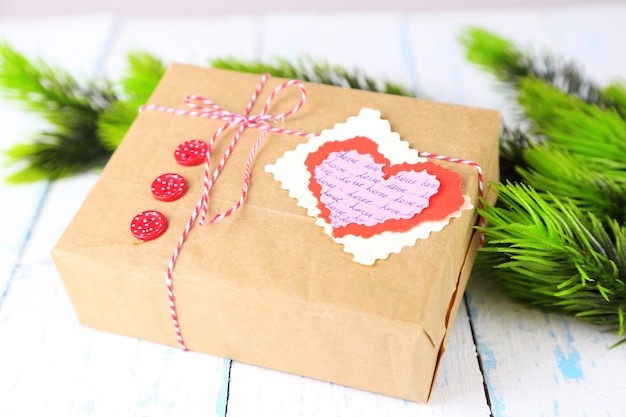 Paper gift box on wooden background