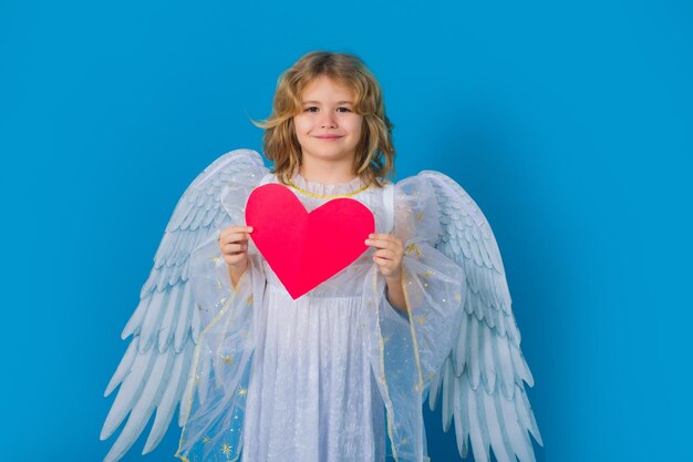 Photo paper heart child with angel wings hold red heart heart symbol love and valentines day valentine