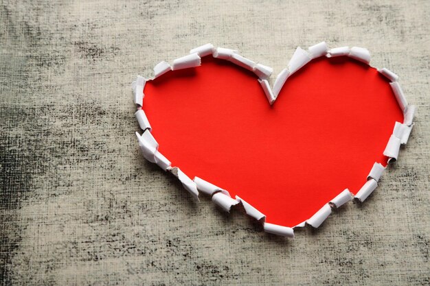 Paper heart on grey textured background