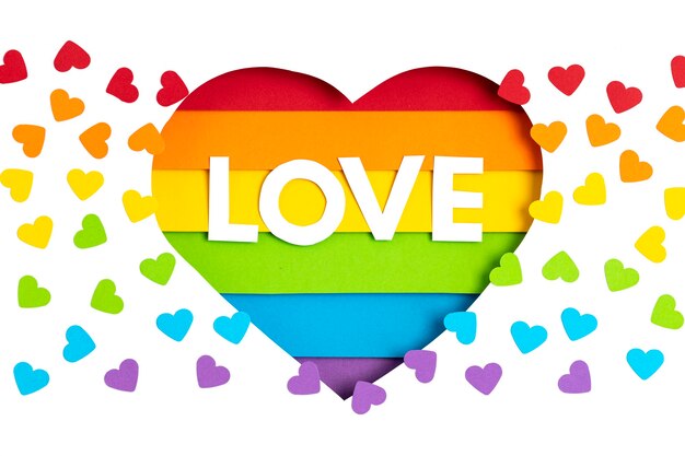 Photo paper heart with rainbow color stripes symbol of lgbt gay pride. love, diversity, tolerance, equality concept