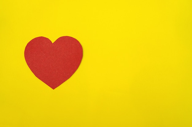 Paper heart on yellow