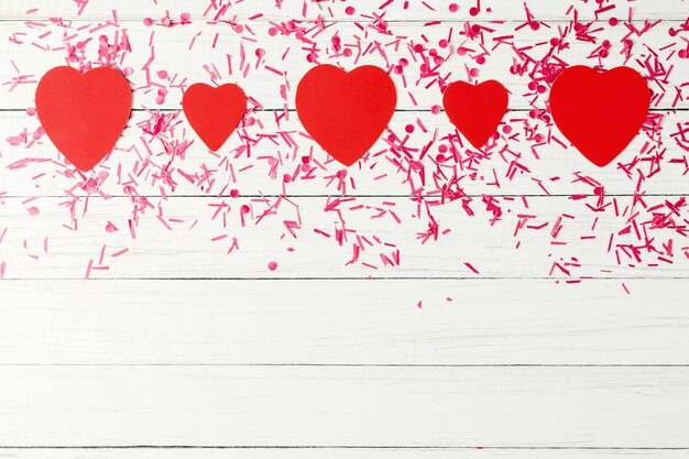 Photo paper hearts with festive confetti