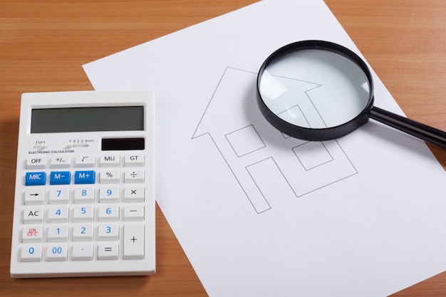 Paper house with Magnifying Glass