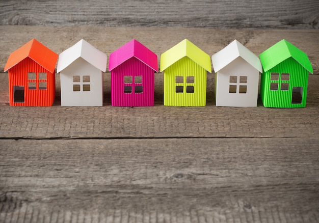 Paper house on wooden table