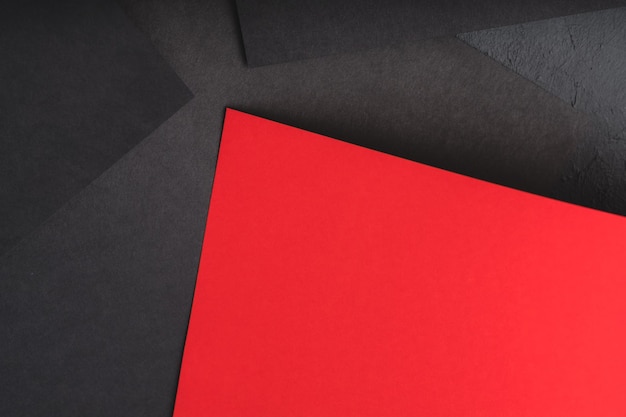 Paper layers black sheets with contrast red accent abstract geometric background with copy space