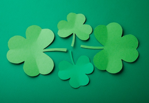 Paper leaf of clover on green background. Happy St. Patrick's Day.