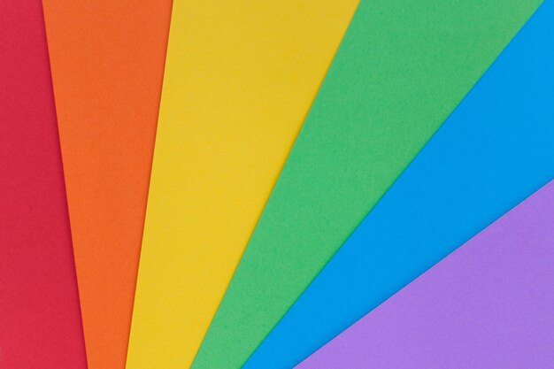 Photo paper in lgbt colors as a background. rainbow colors. pride community.