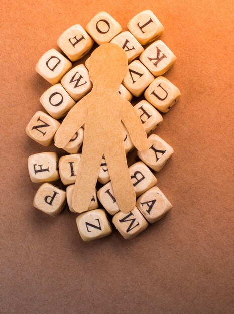 Paper man and letter cubes of made of wood