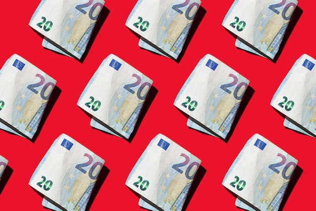 paper money euro bills on red background