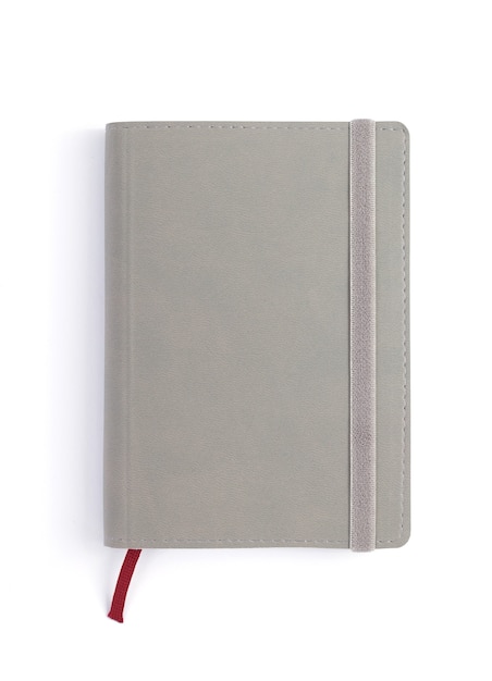 Paper notebook at white background, top view