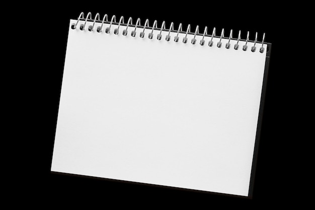 A paper page notebook isolated on the black background