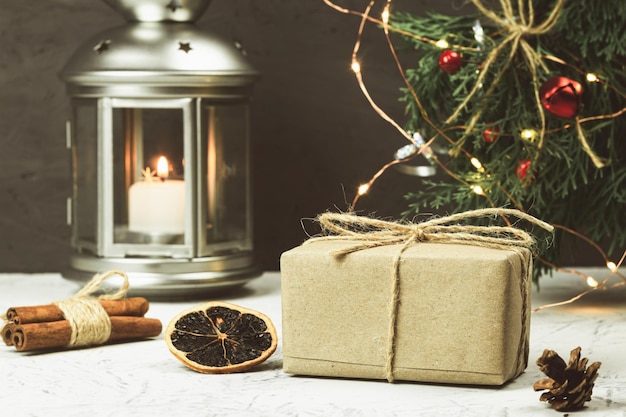 Photo paper parcel wrapped with a price tag on a wooden background