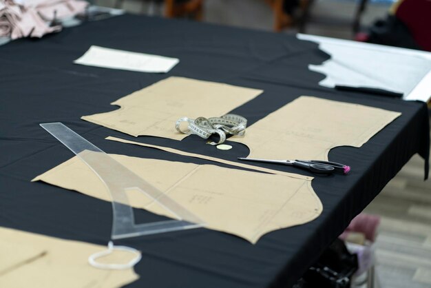 paper pattern of clothes on the table in the dressmaking workshop