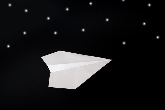 Paper plane on black background minimalist mockup