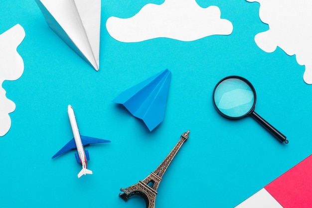Paper plane  on a blue background with clouds