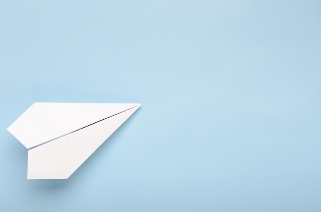 Paper plane on a blue background.