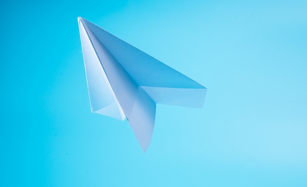 a paper plane in the sky