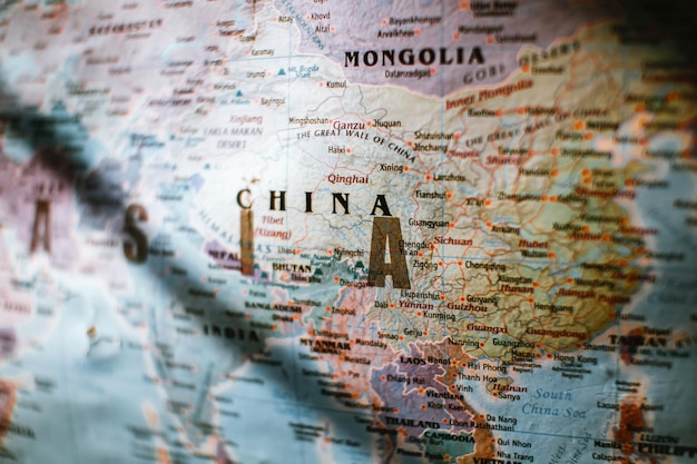 Paper political world map with Asian countries borders and coastline near water Photo
