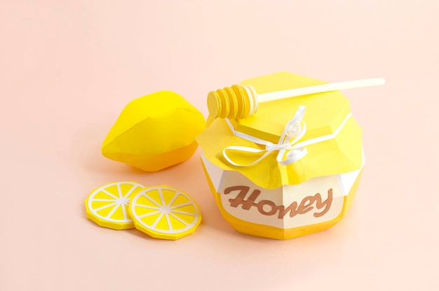 Paper pot with honey and dipper lemon and slices