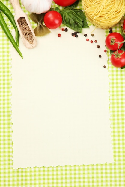 Photo paper for recipesvegetables and spices on green background