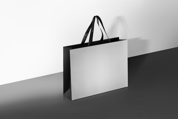 Photo paper shopping bags mockup with black handles