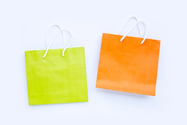 Paper shopping bags on white background.