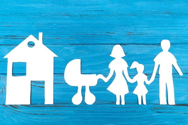 Paper silhouette of family with baby carriage