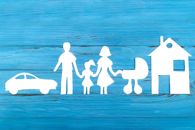 Paper silhouette of family with baby carriage