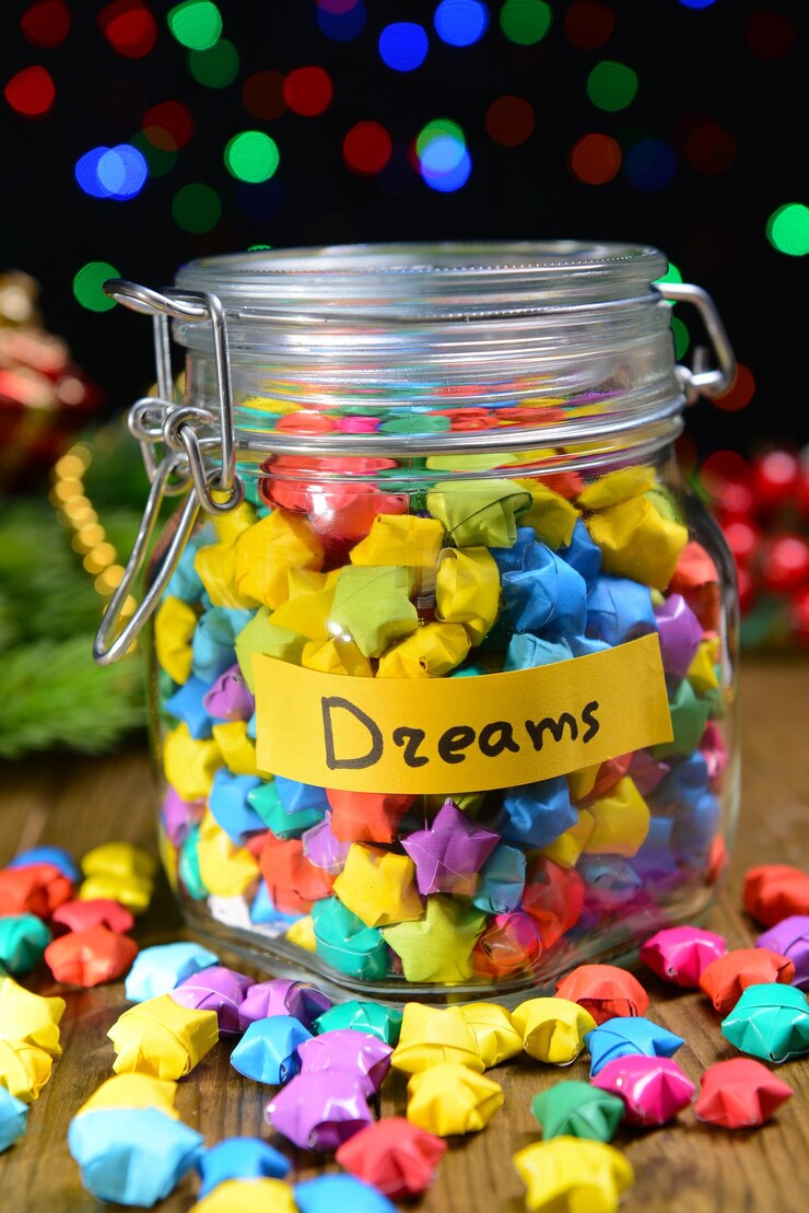 Photo paper stars with dreams on table