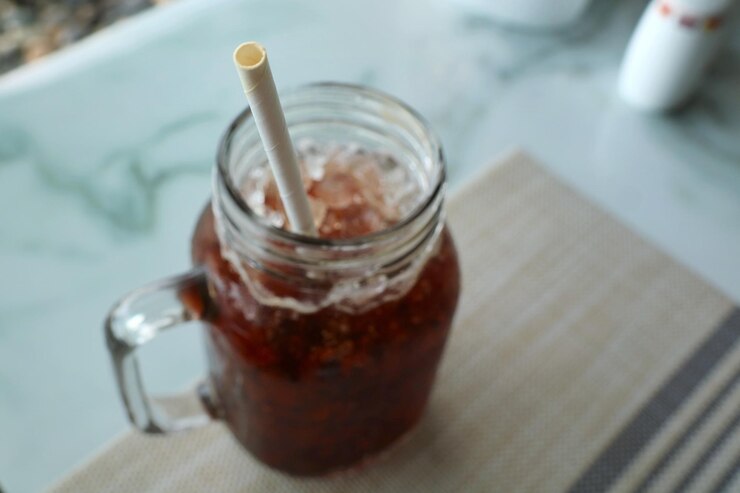 Photo paper straw on a ice coffee glass paper straw is good for environment more than plastic straw
