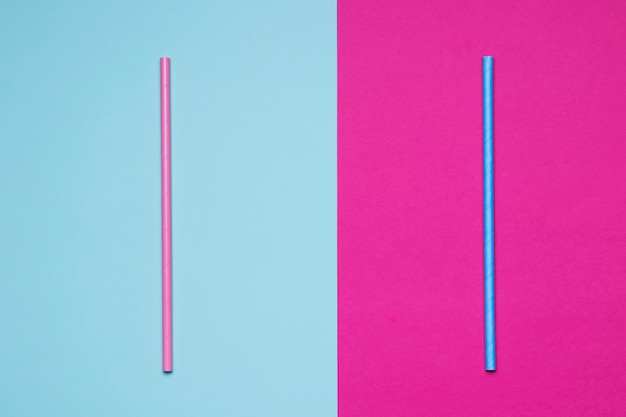 Photo paper straws on bicolored background