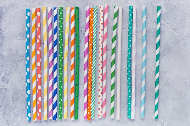 Paper straws on grey