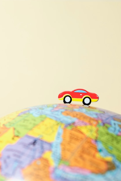 Photo paper style earth globe with car