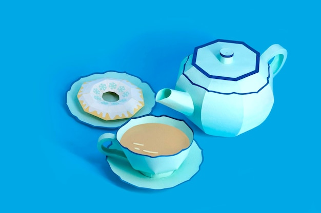 Photo paper teapot cup with tea and donuts