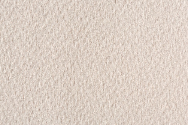 Paper texture background in light cream tone