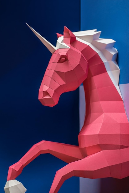 Paper unicorn head on a colored background