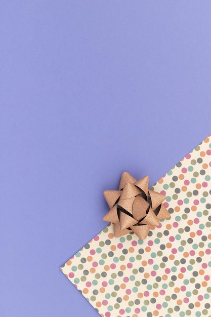 Paper with bows on a purple background