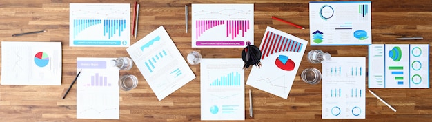 Photo paper with business chart on wooden office table