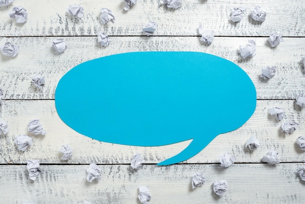 Photo paper wraps placed around speech bubble with important information wrinkled notes arranged all