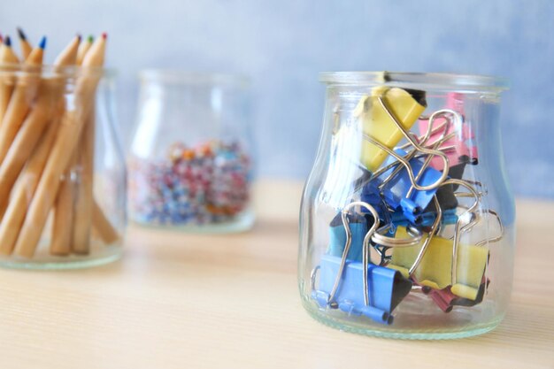 Photo paperclips and other tools in glass jars