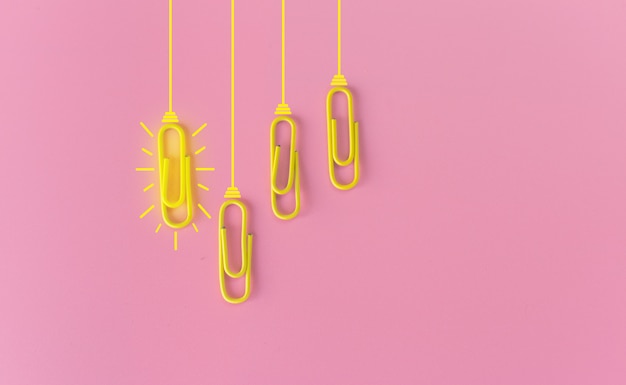 paperclips on pink background