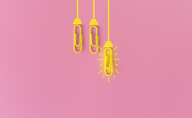 paperclips on pink background