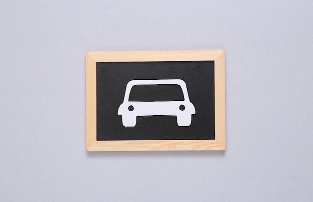 Papercut car on gray background