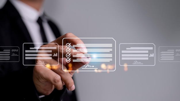 Paperless workplace ideas esigning electronic signature\
document management a businessman signs an electronic document on a\
digital document on a virtual screen using a stylus pen