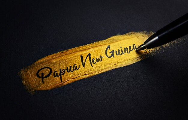 Papoea-Nieuw-Guinea handschrifttekst op gouden verfpenseelstreek